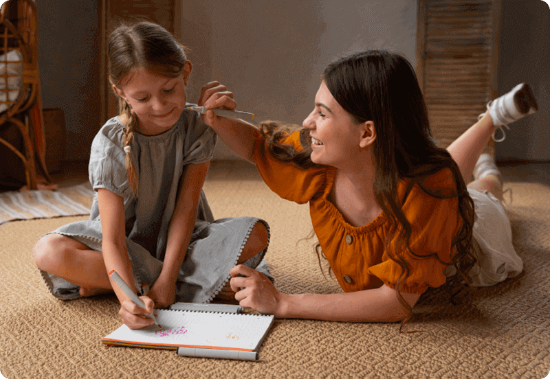 Au pair on a Spanish visa playing with child