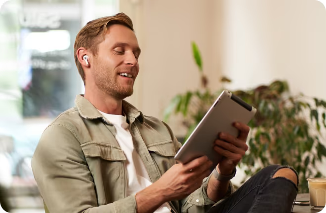 investor visa seeker looking at a tablet.