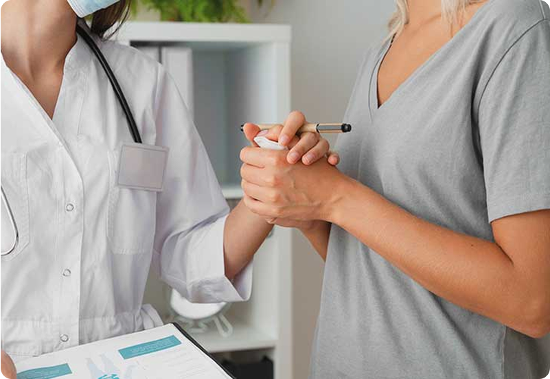 Filipino doctor helping expat patient with health insurance