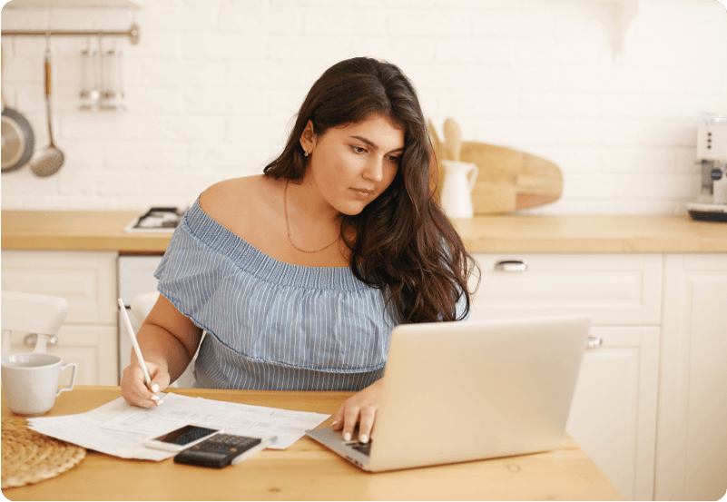 Entrepreneur visa applicant working on her computer