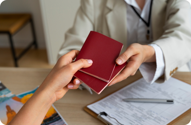 2 hands with 2 passports