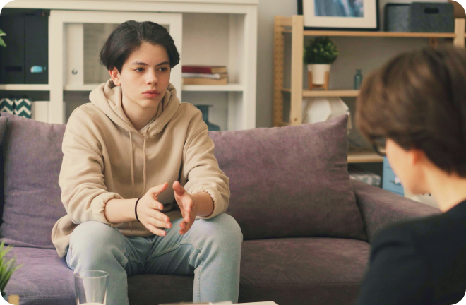 teenager sitting on a couch
