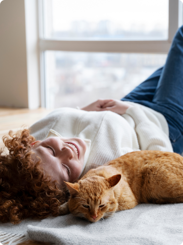 cat and woman laying down