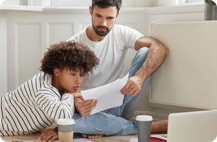 Couple reading rental contract from landlord