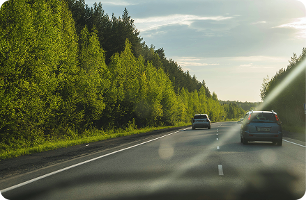 Cars driving on a road.