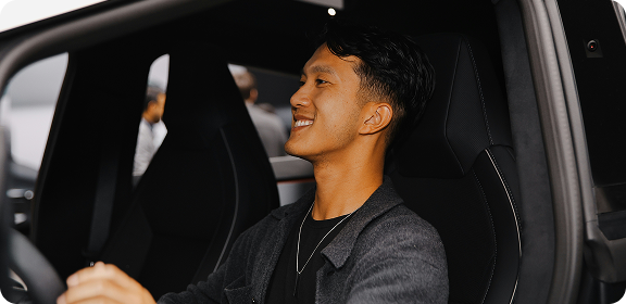 A man driving a car.