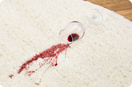 Wine spilled on a beige carpet.