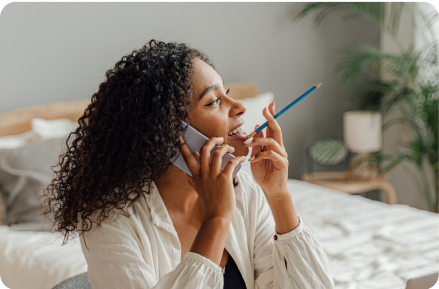 Woman talking on a phone.