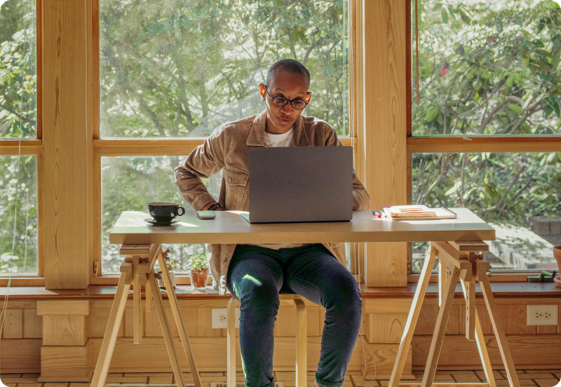 Person working on a laptop at home.