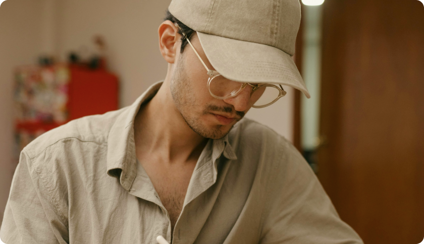 A man sitting and working on his laptop.