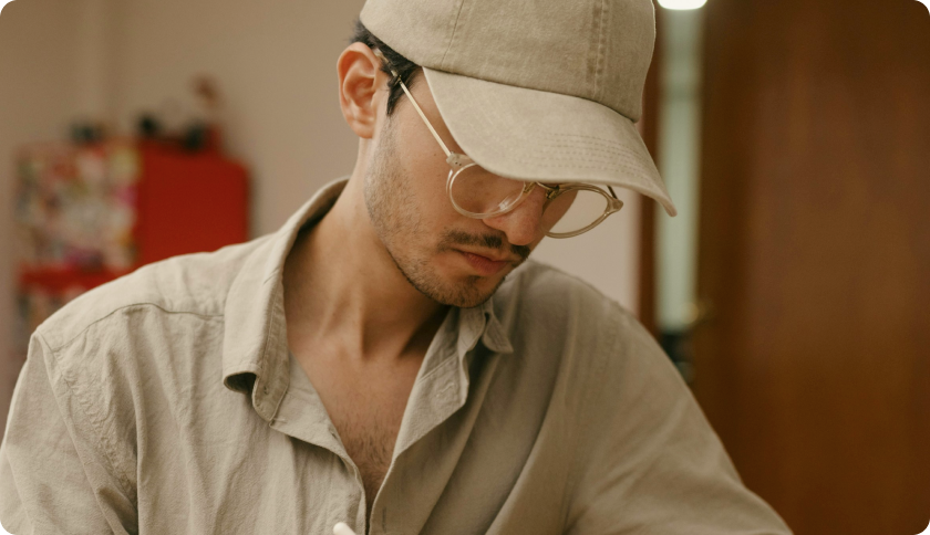 A man sitting and working on his laptop.