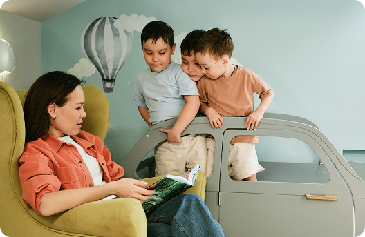 A mom and her two kids reading a fairytale
