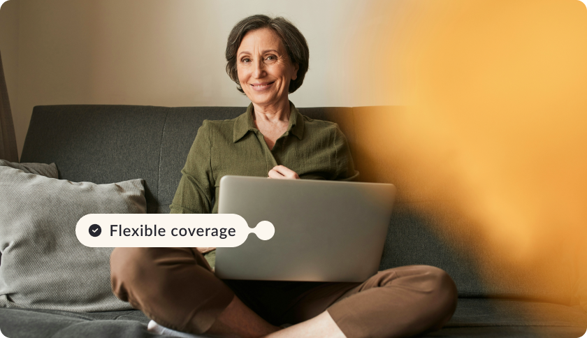 A woman who's an expat in Portugal adjusting her policy on a laptop.