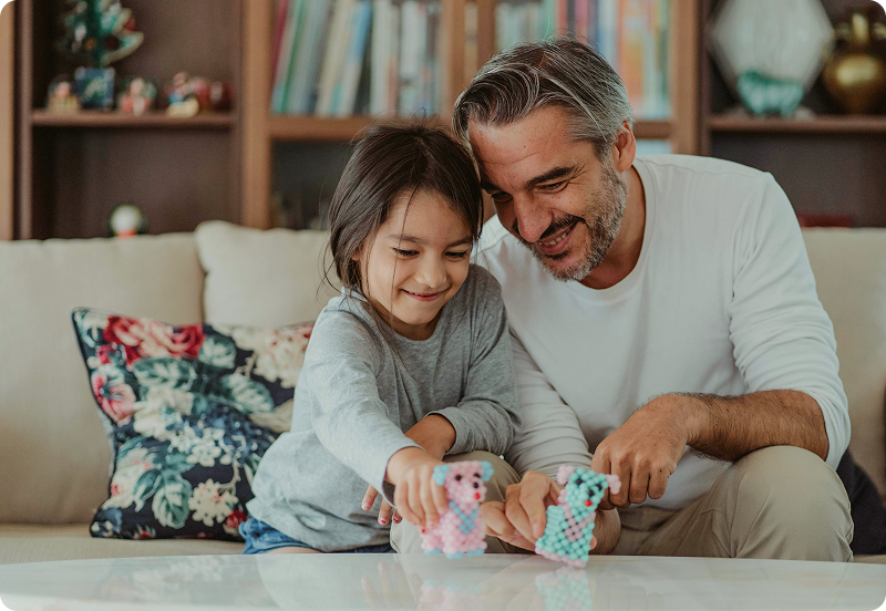 Father and a daughter playing together.