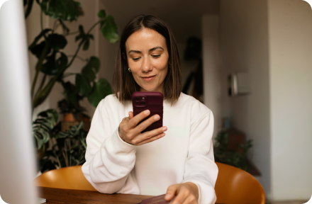 A woman looking at her phone